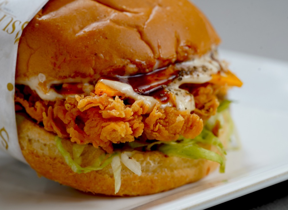 Black Pepper Melt, Crispy chicken, garlic mayo, BBQ sauce, slice cheese and iceberg, Sufraq Karachi