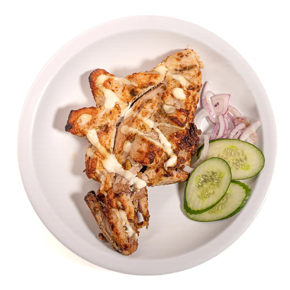 Malai Tikka Chest, Creamy marinated chicken, slow-grilled with a smoky char, Sufraq Karachi