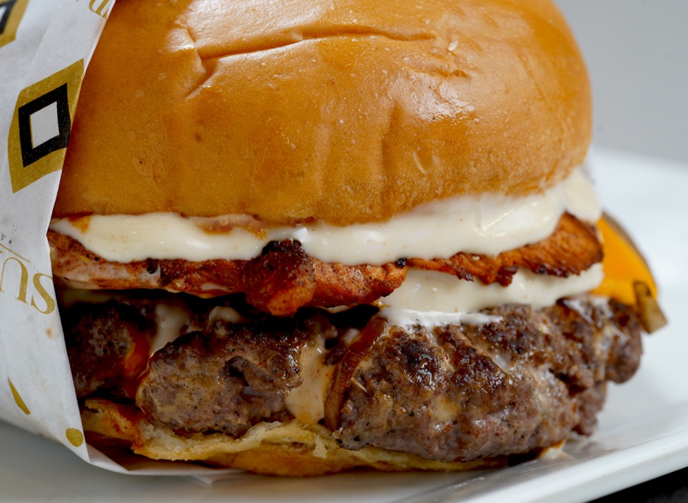 The Beast, A mighty combo of one chicken patty and one beef patty with cheese, garlic mayo and iceberg, Sufraq Karachi
